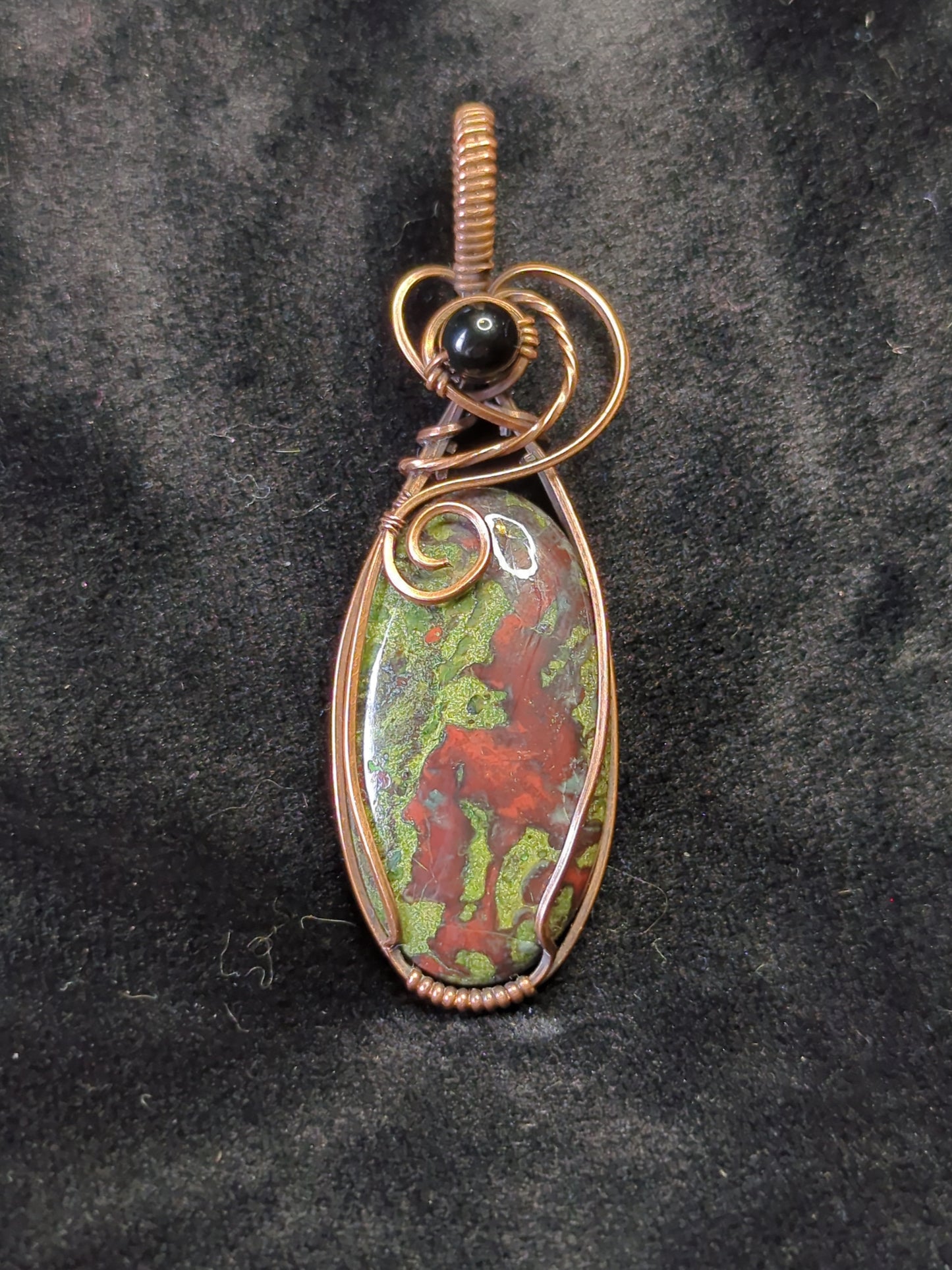 Dragons Blood Jasper, set in antiqued copper, accented with black agate.