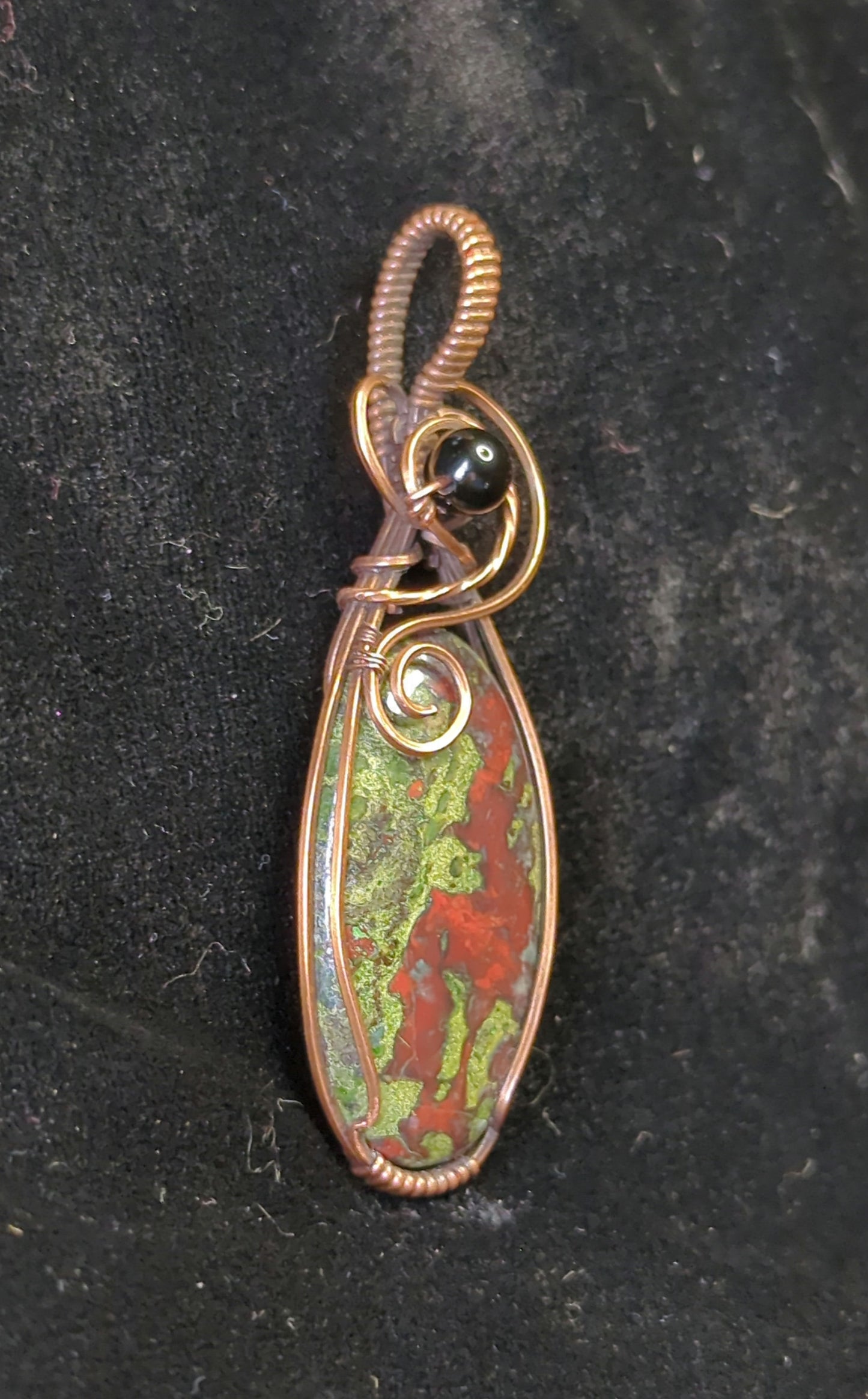 Dragons Blood Jasper, set in antiqued copper, accented with black agate.