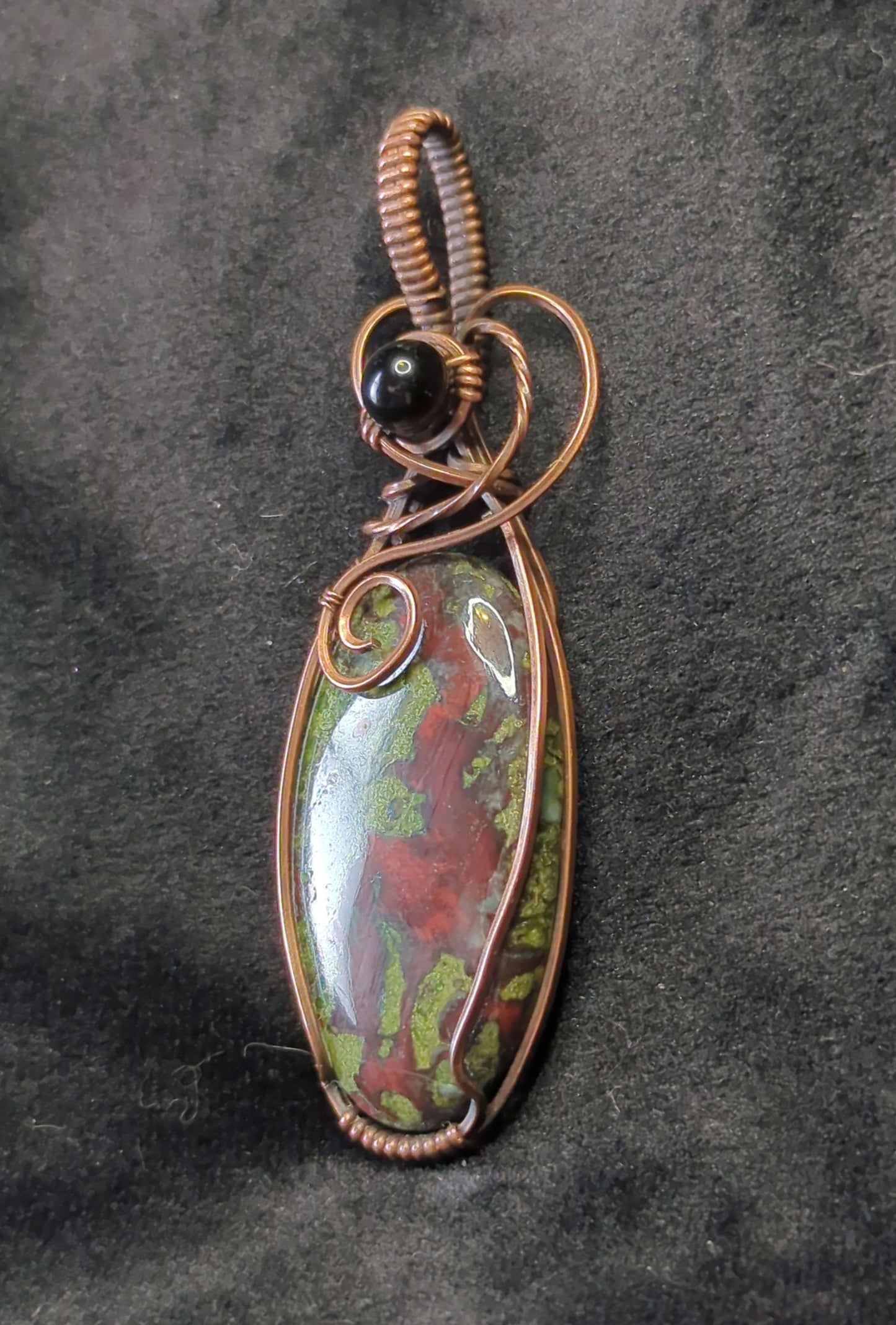 Dragons Blood Jasper, set in antiqued copper, accented with black agate.