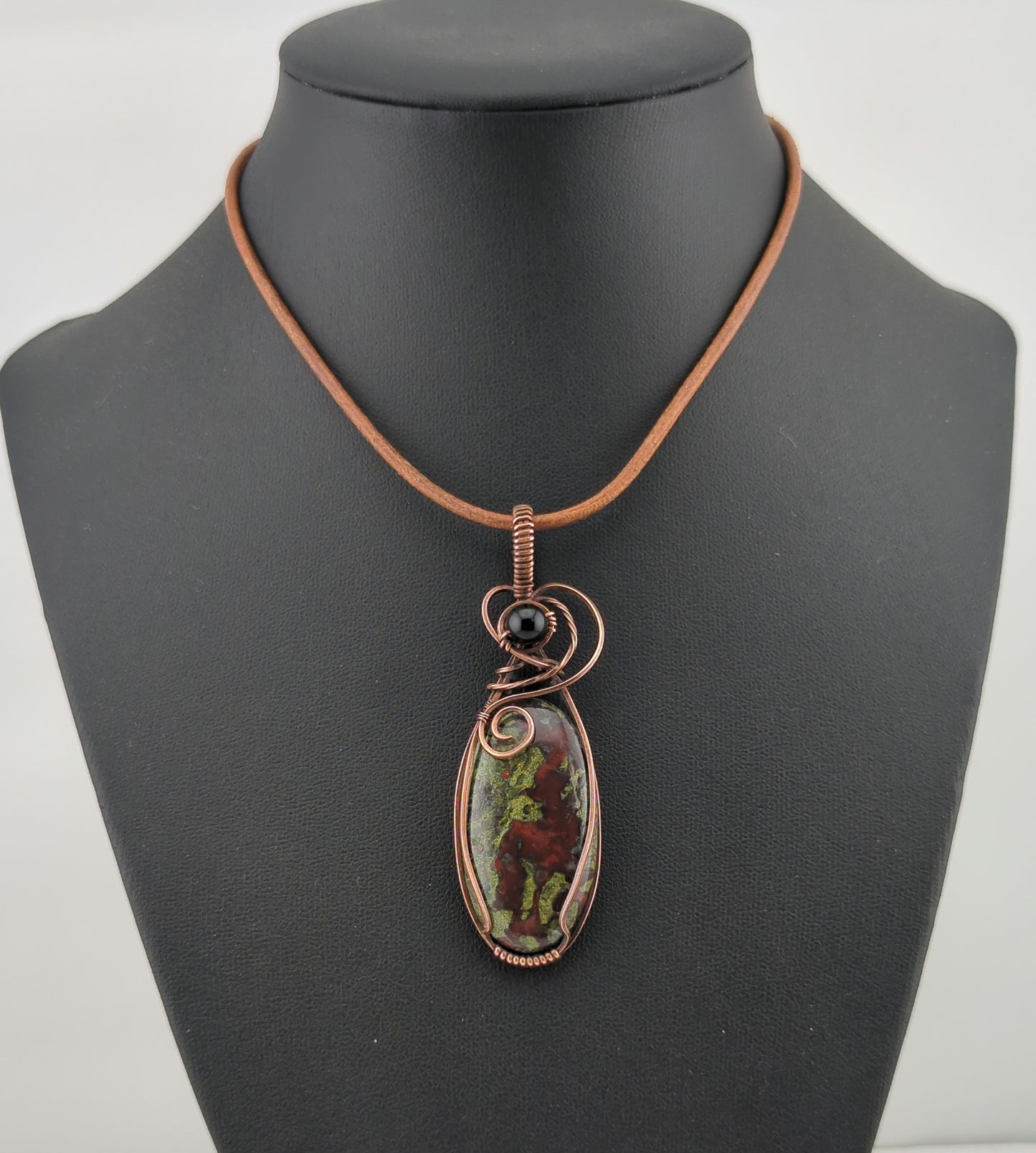 Dragons Blood Jasper, set in antiqued copper, accented with black agate.