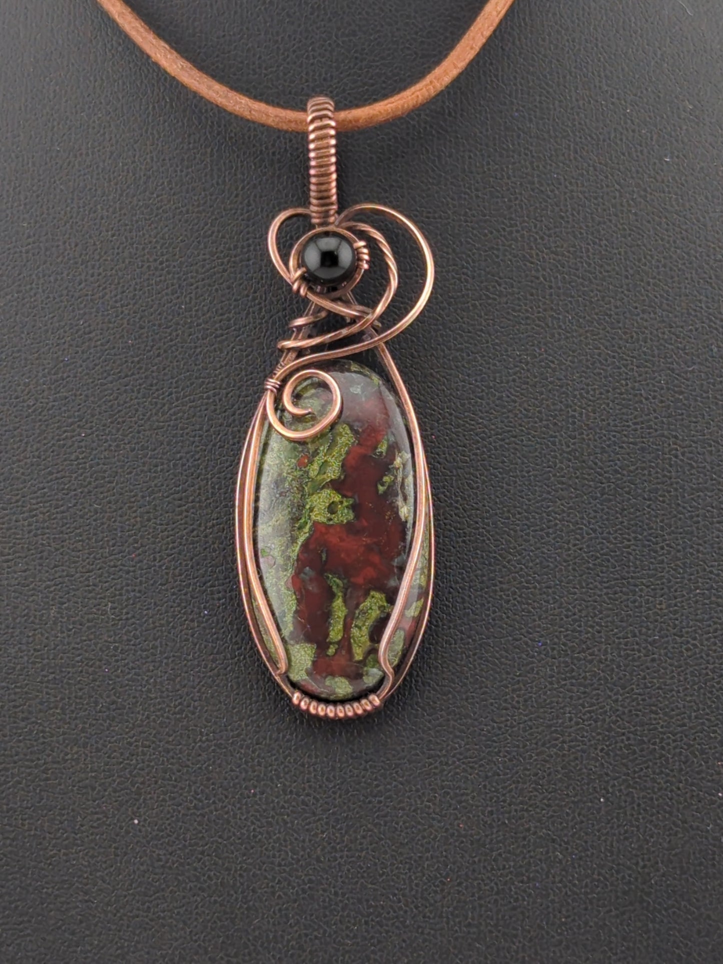 Dragons Blood Jasper, set in antiqued copper, accented with black agate.
