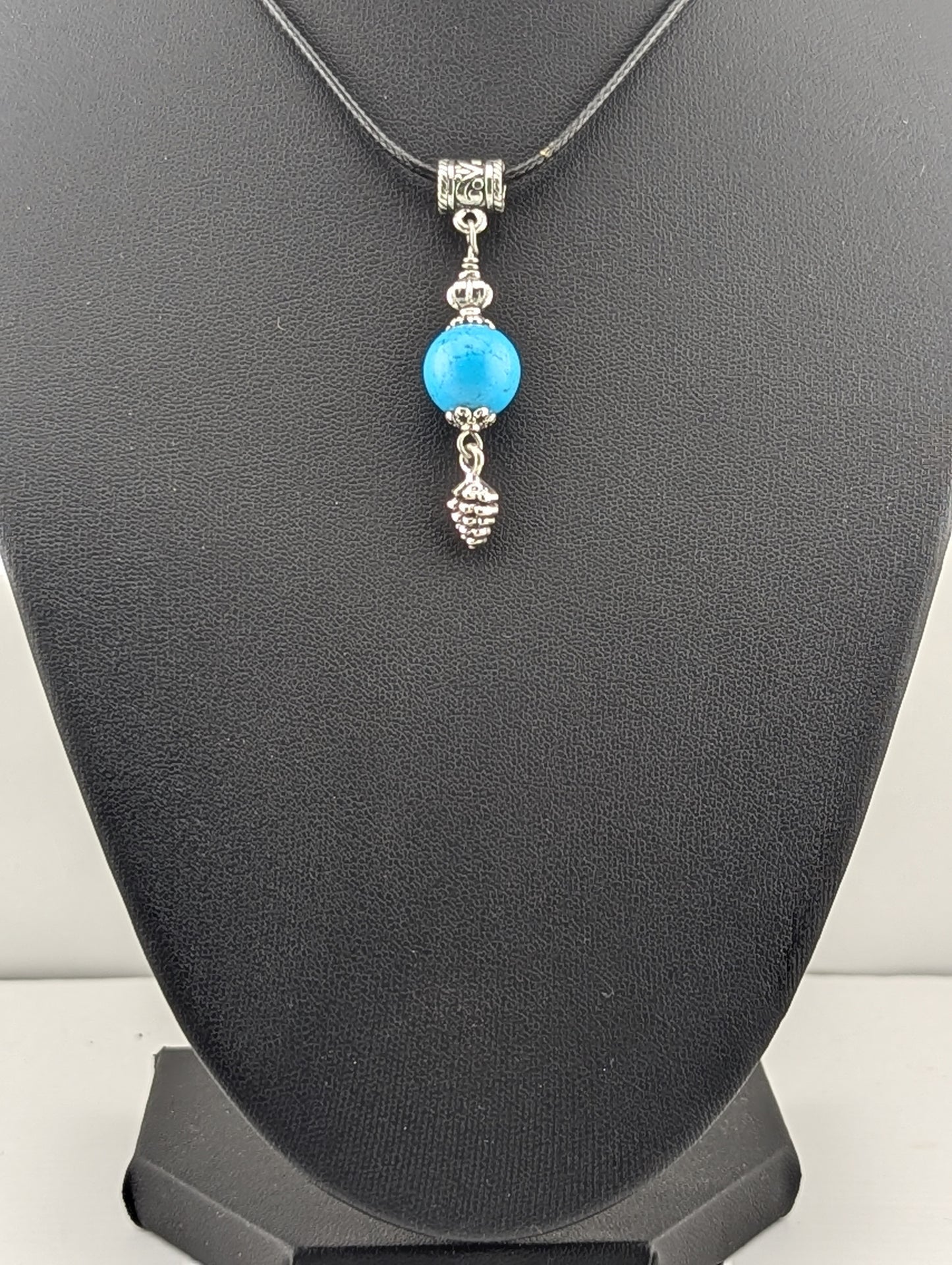 Turquoise pendant with a Pine Cone, in antiqued Silver finish
