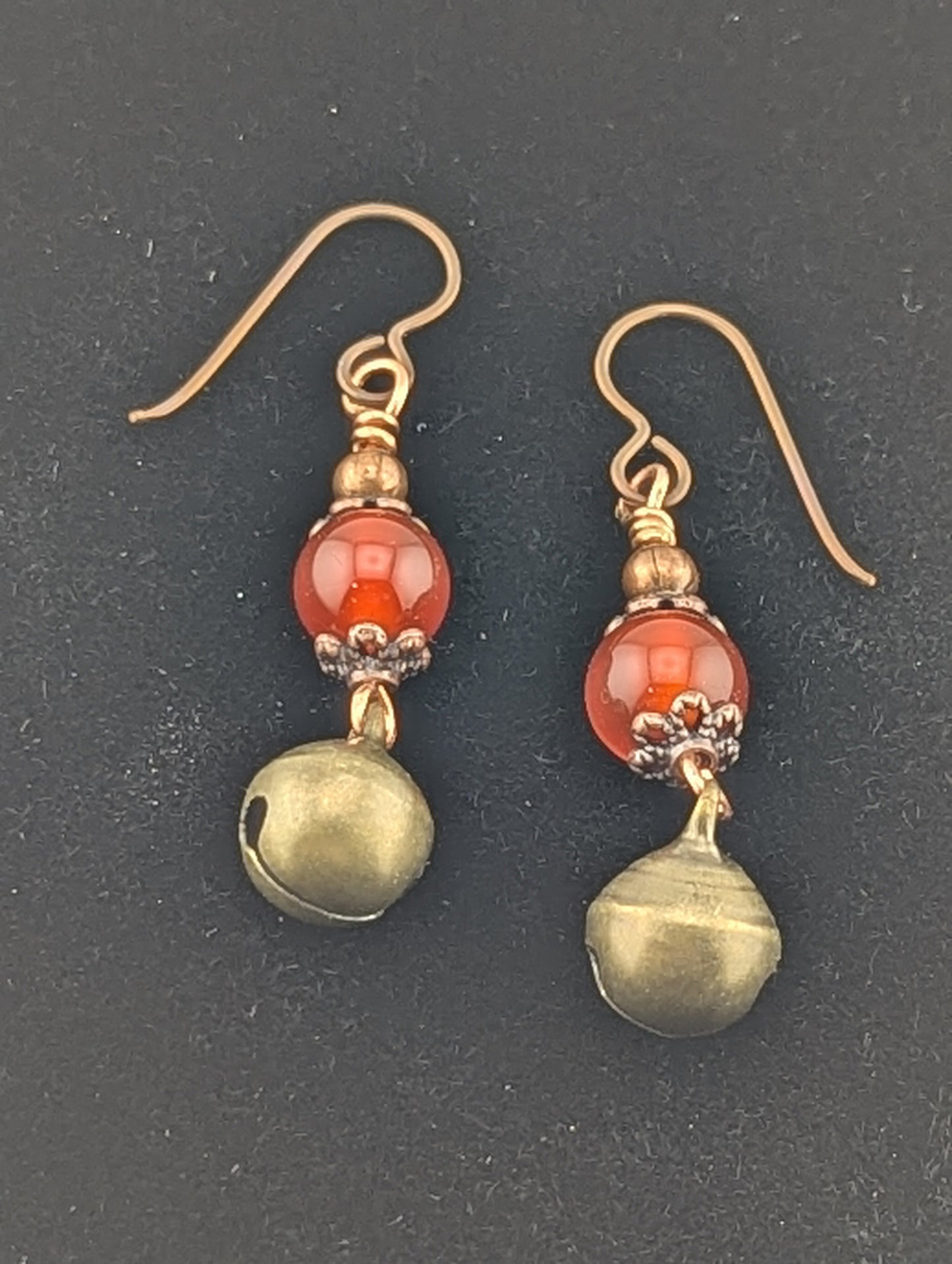 Carnelian earrings with a Jingle Bell charm in antiqued Copper finish