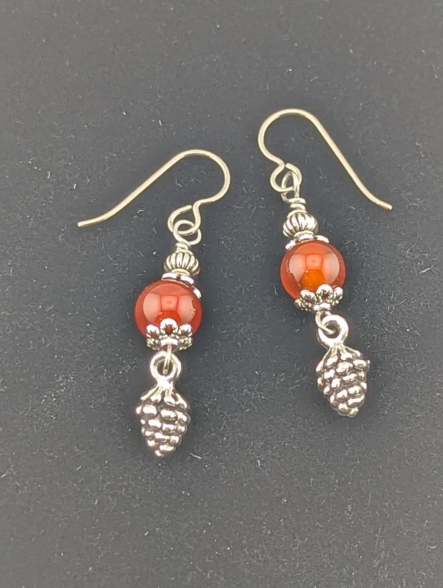 Carnelian earrings with a Pine Cone charm in antiqued Silver finish