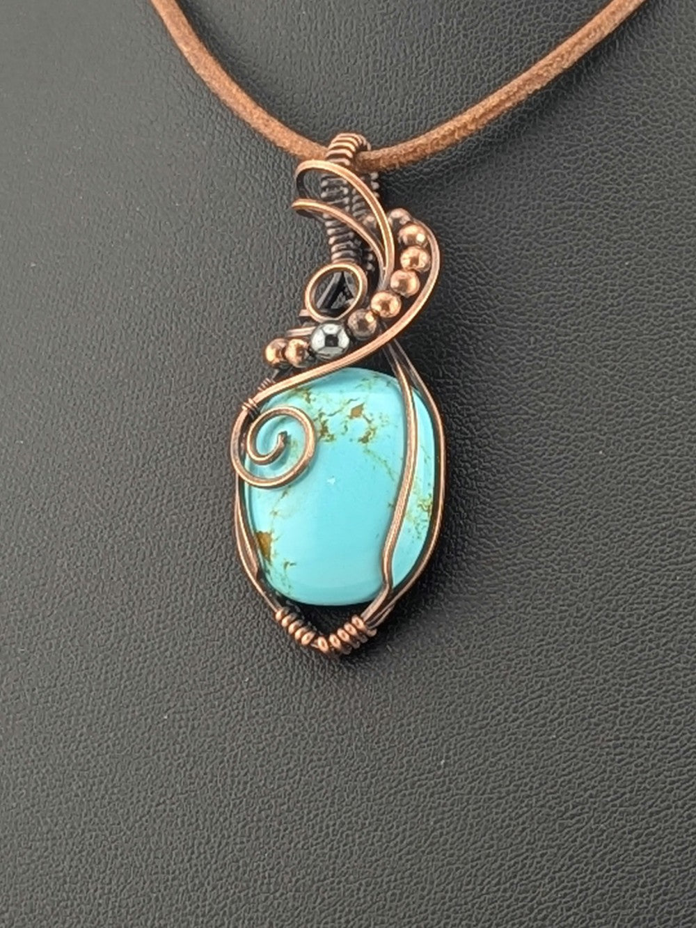 Turquoise pendant, set in antiqued copper