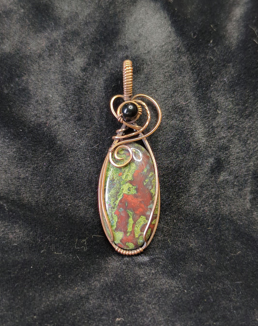 Dragons Blood Jasper, set in antiqued copper, accented with black agate.