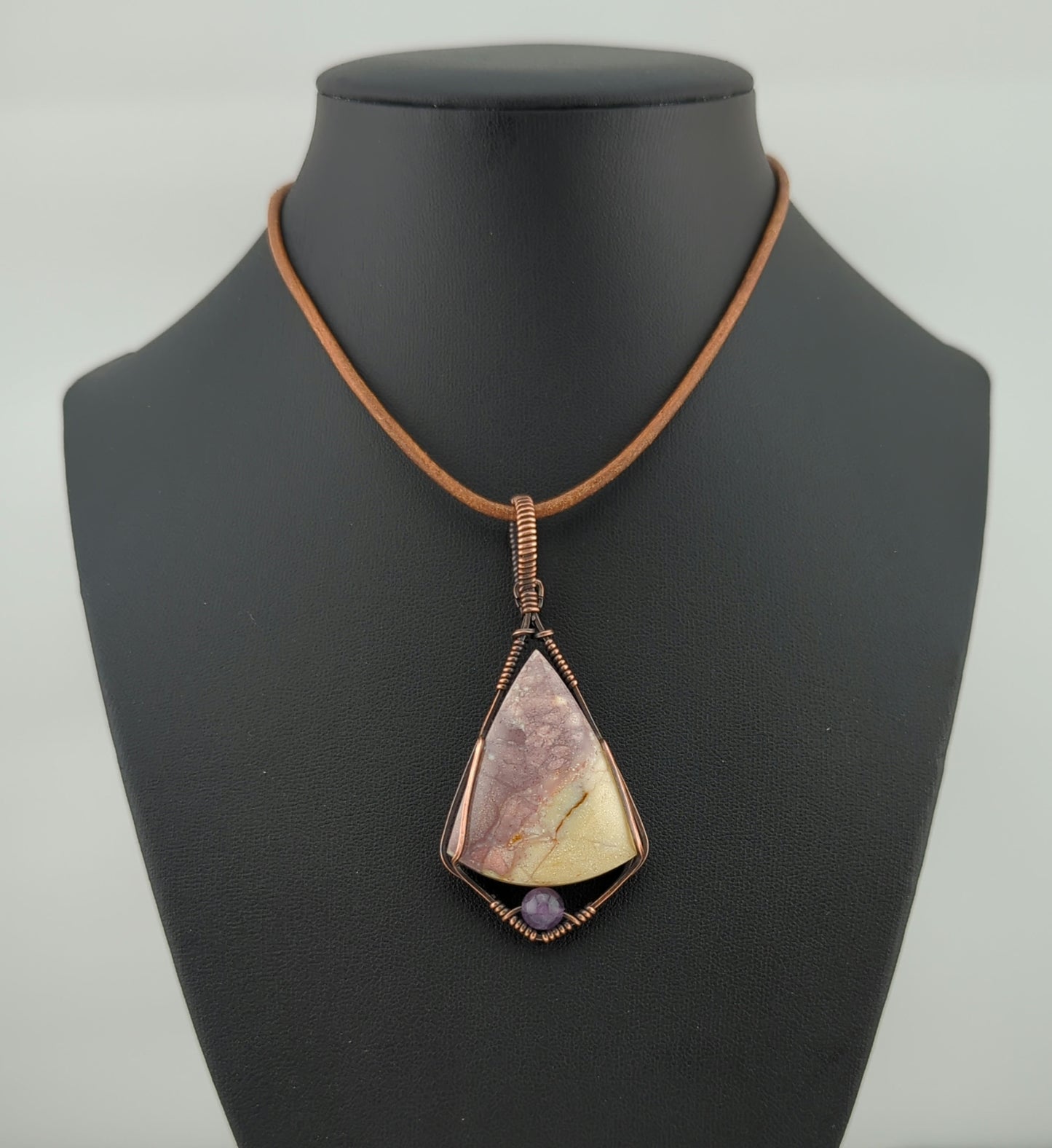 Indonesian agate Pendant, set in antiqued copper, accented with Amethyst.