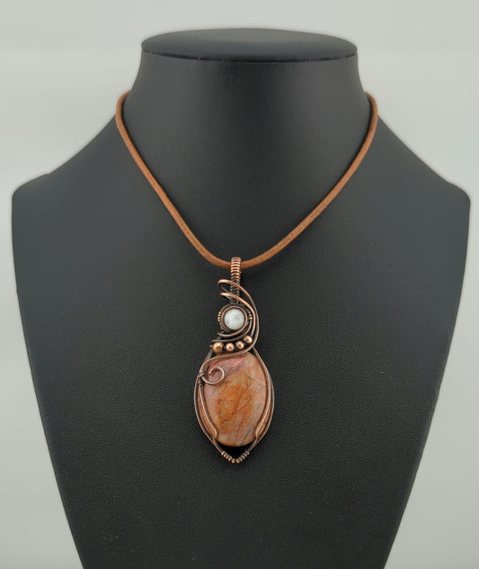 Fire Quartz Pendant, set in antiqued copper, accented with Moonstone.