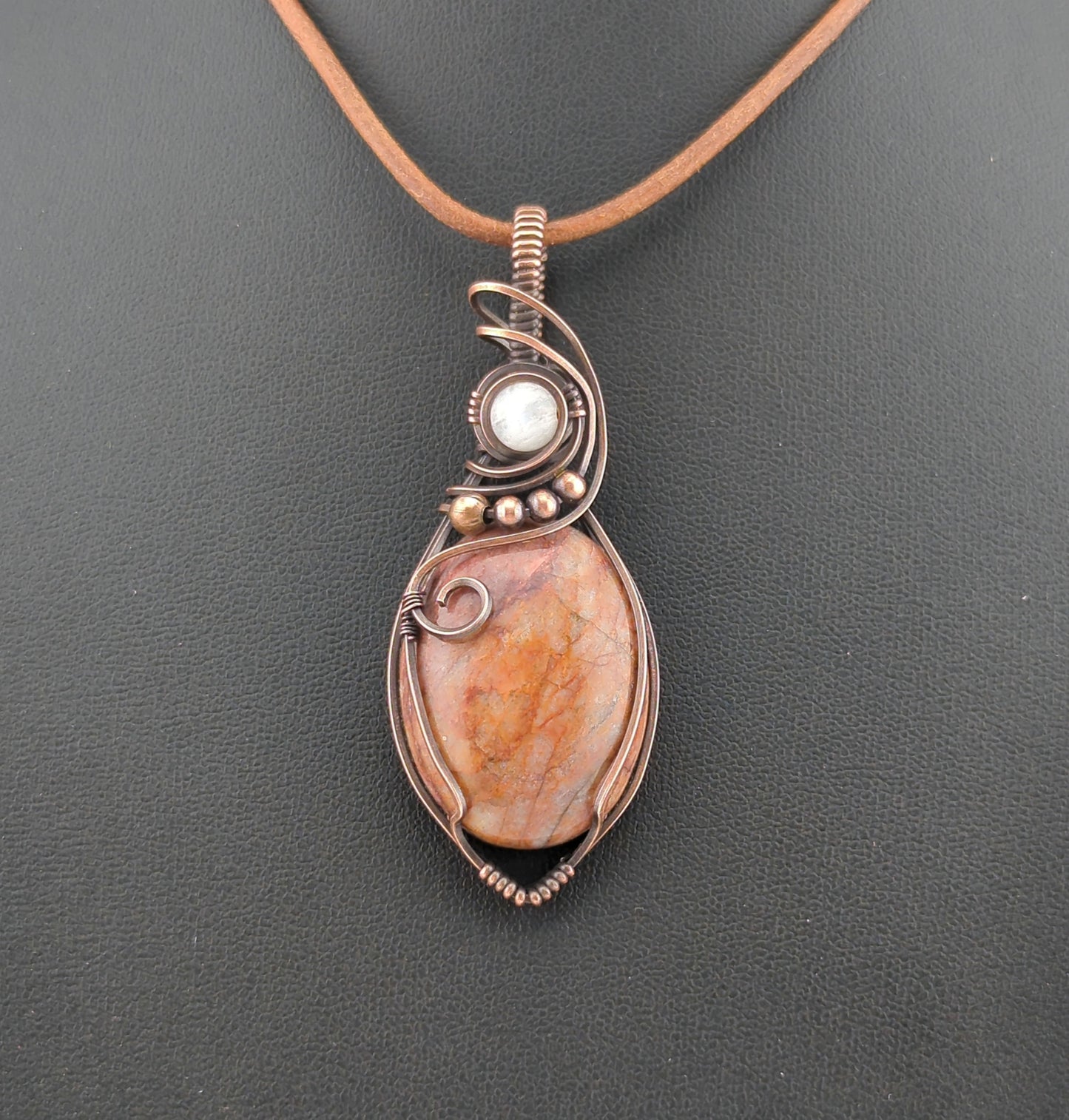 Fire Quartz Pendant, set in antiqued copper, accented with Moonstone.