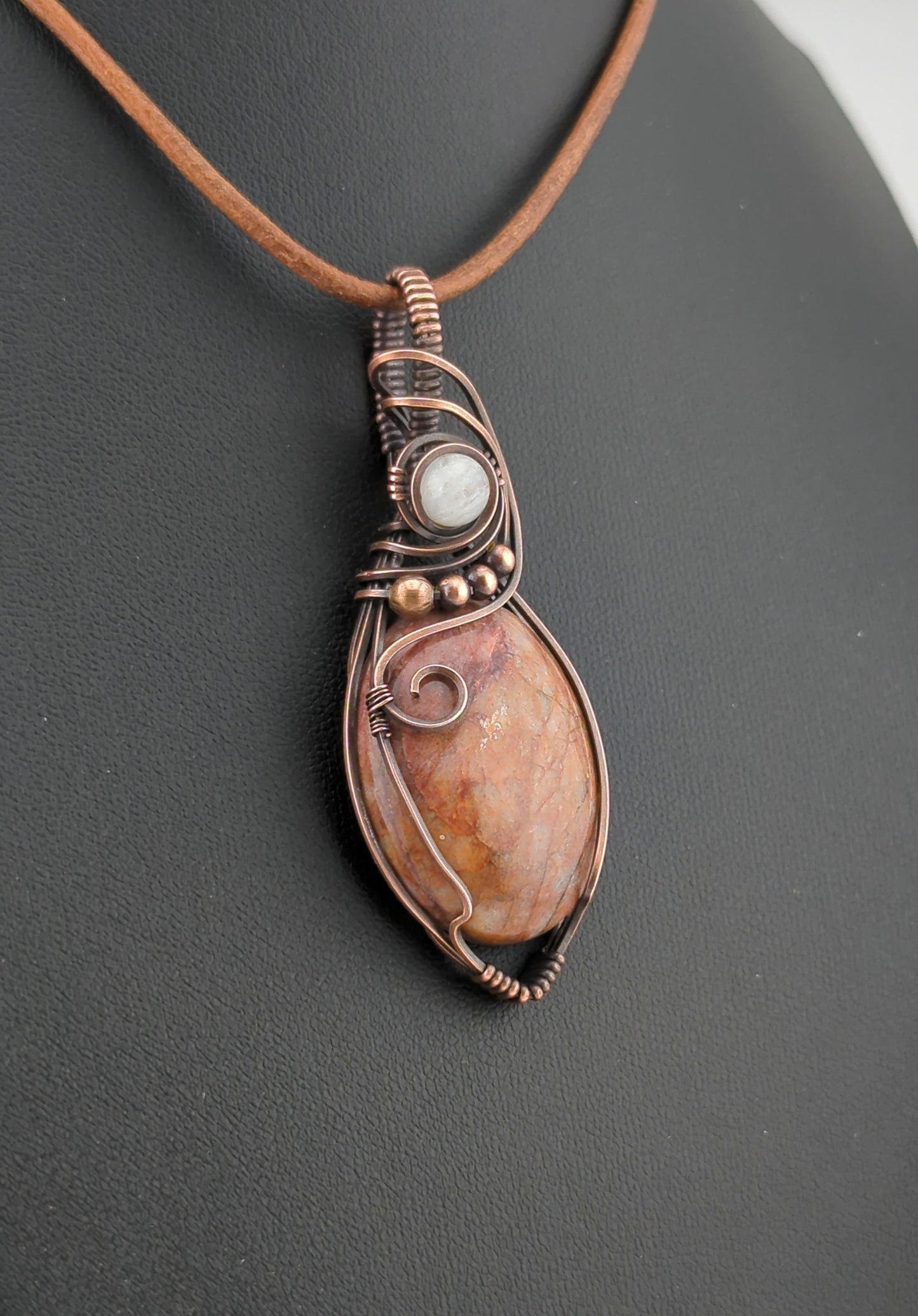 Fire Quartz Pendant, set in antiqued copper, accented with Moonstone.