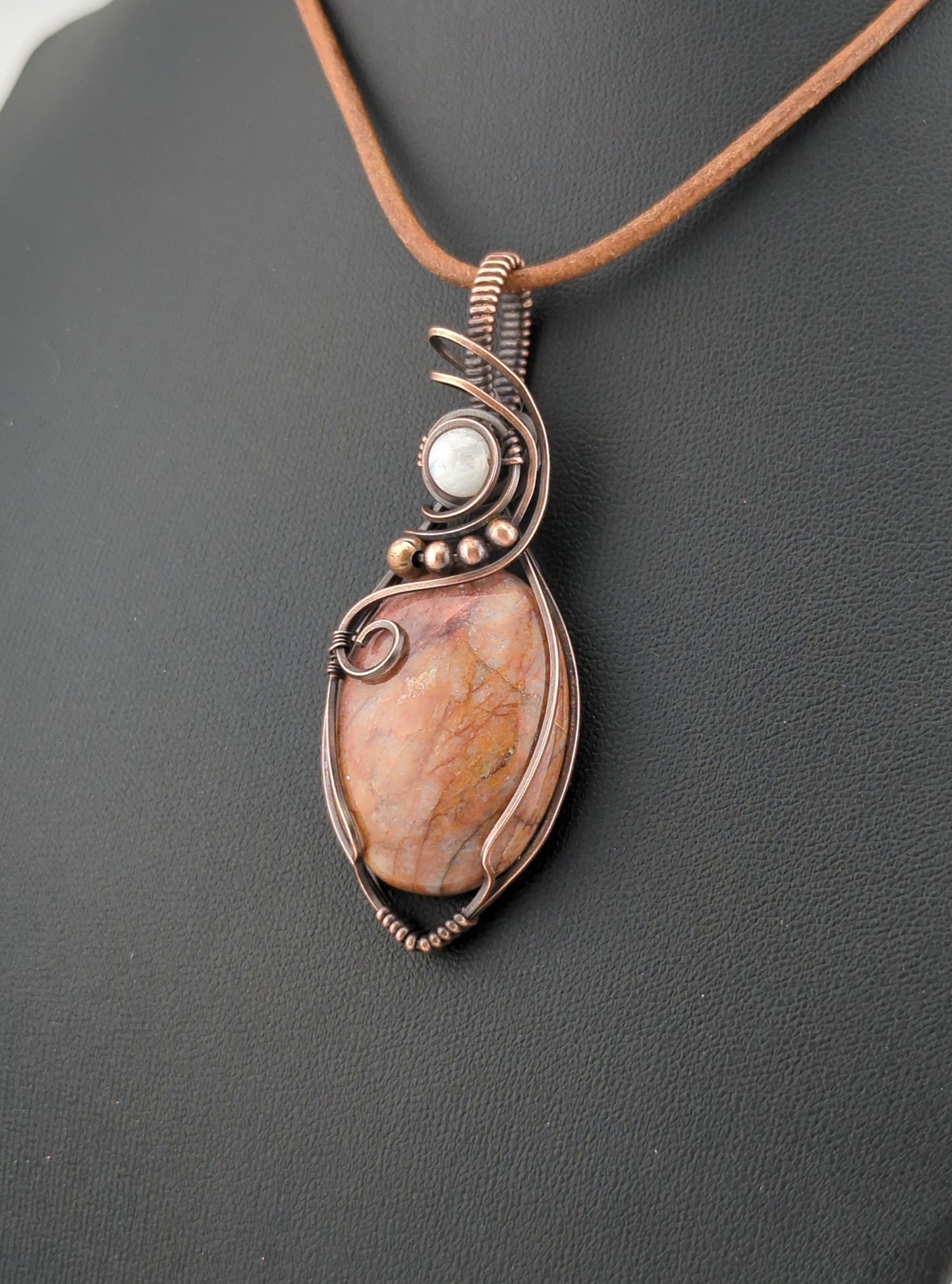 Fire Quartz Pendant, set in antiqued copper, accented with Moonstone.