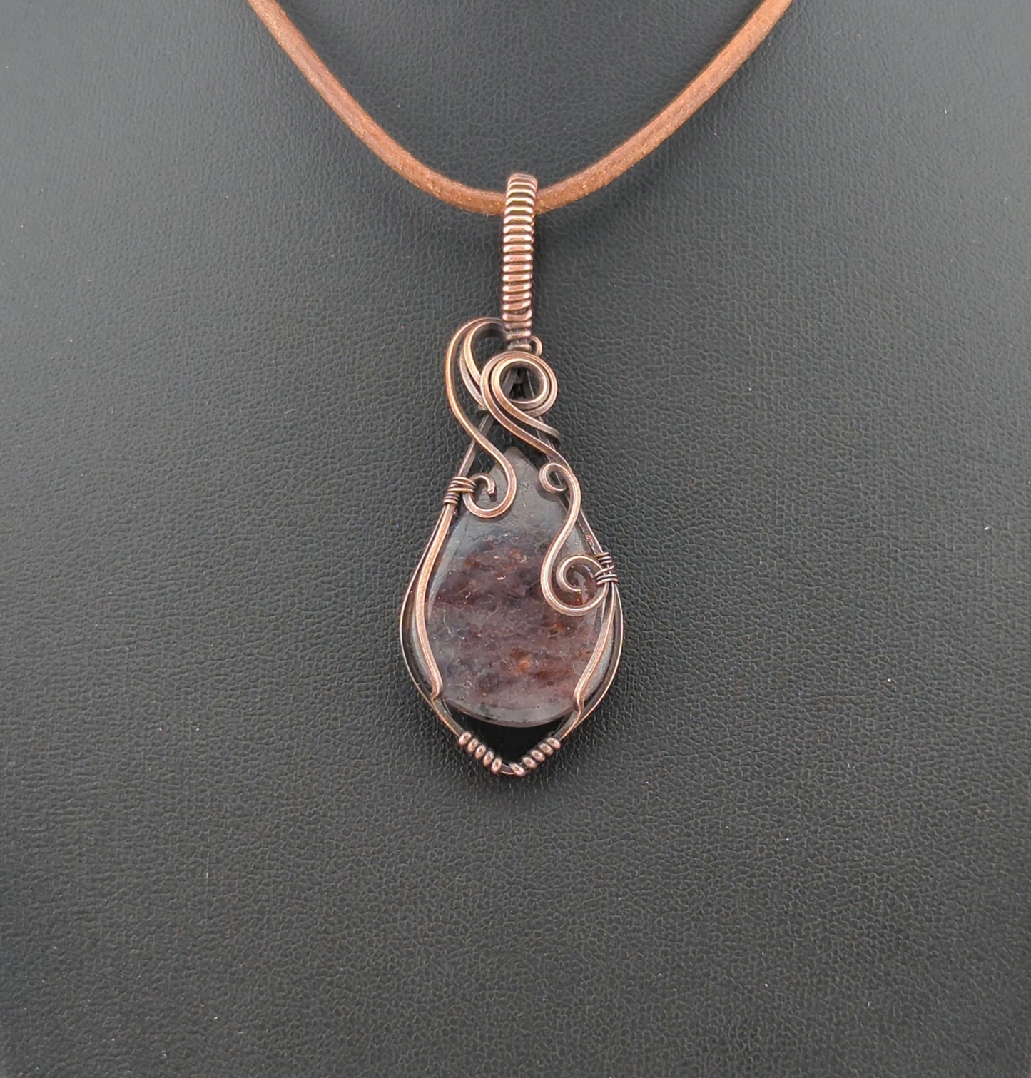 Bloodshot Iolite Pendant, set in antiqued copper.