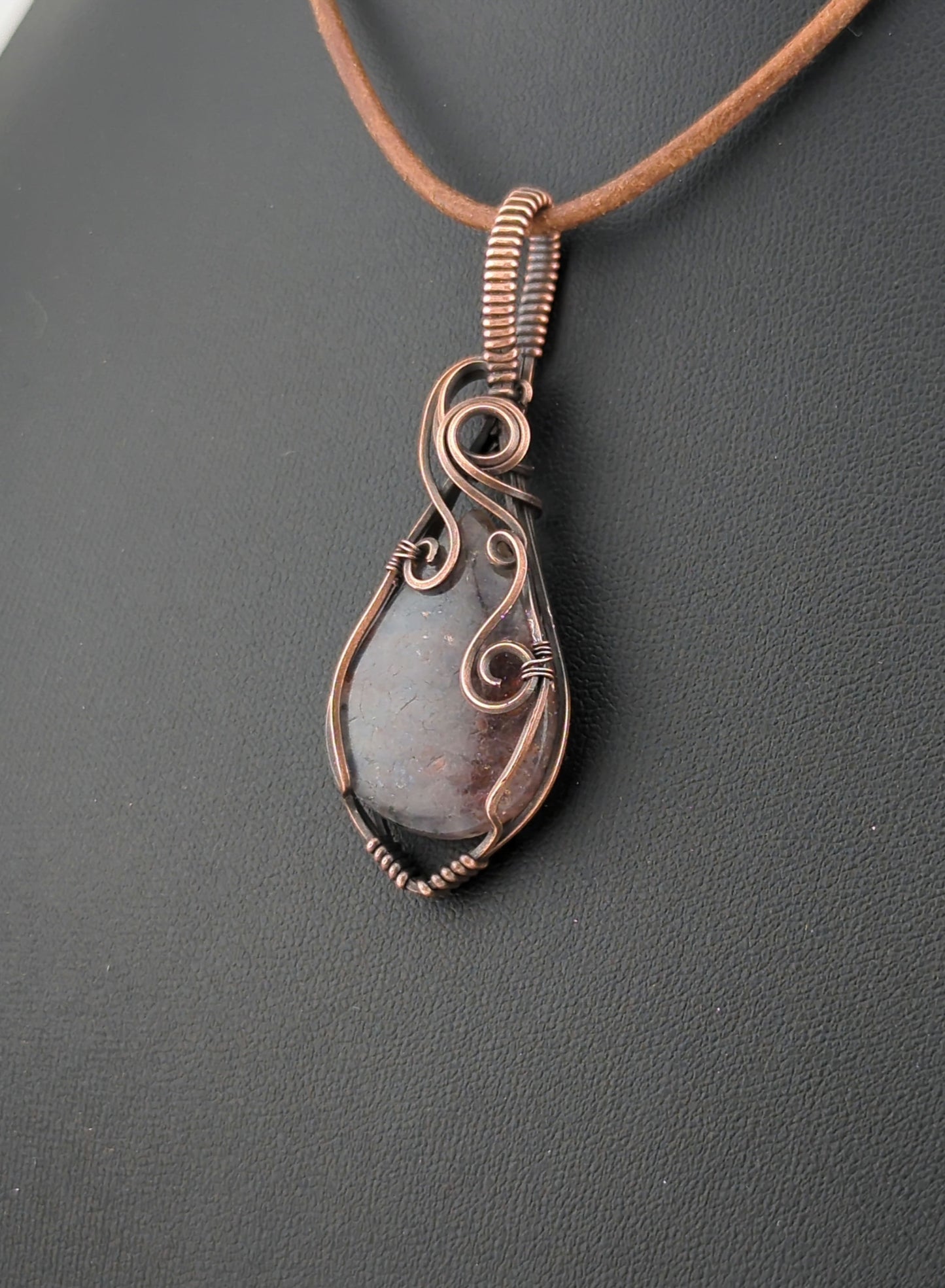 Bloodshot Iolite Pendant, set in antiqued copper.