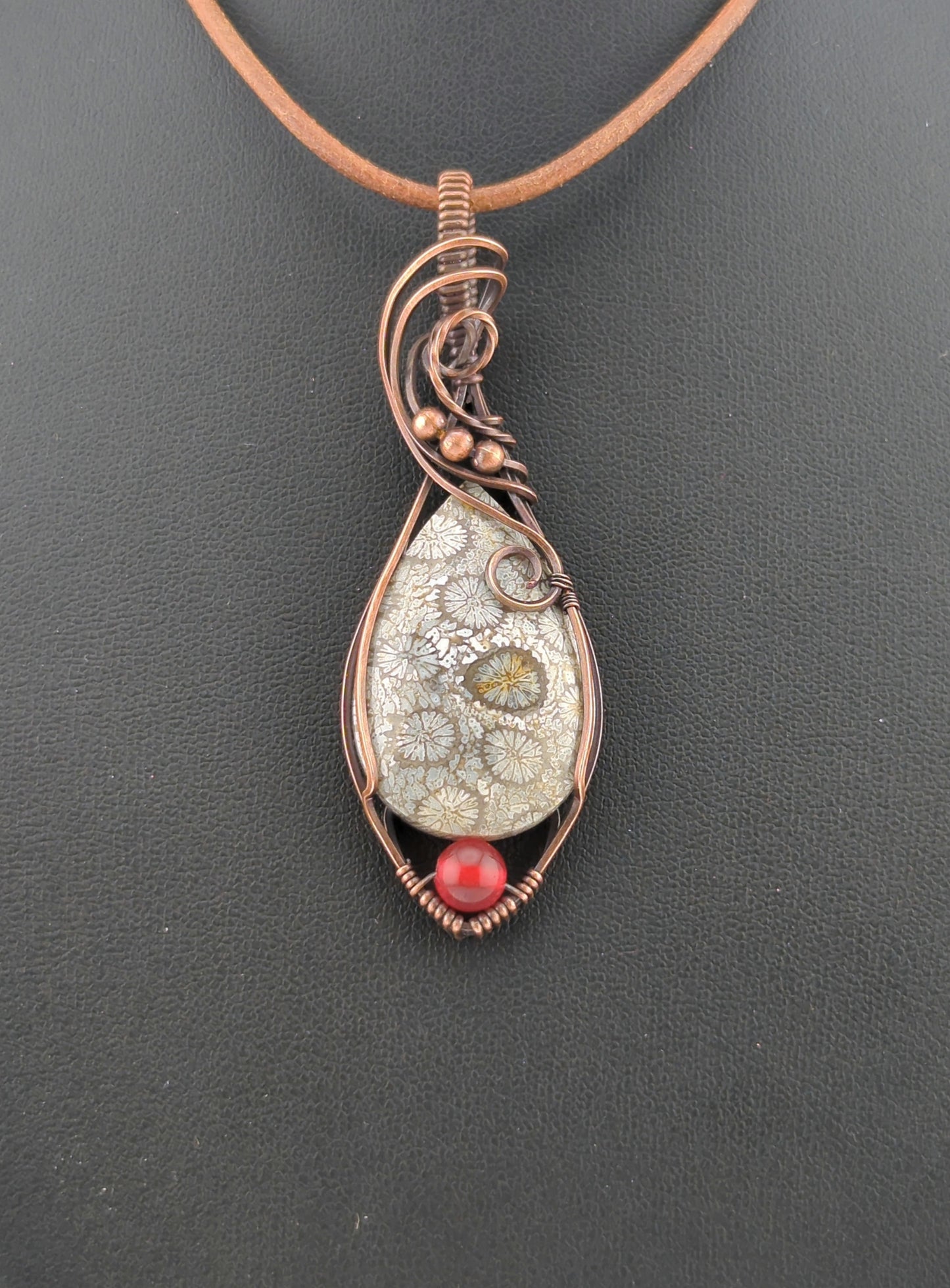 Coral Fossil Pendant, set in antiqued copper, accented with Carnelian.