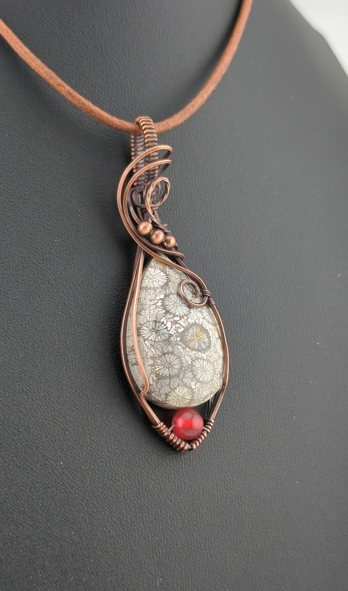 Coral Fossil Pendant, set in antiqued copper, accented with Carnelian.