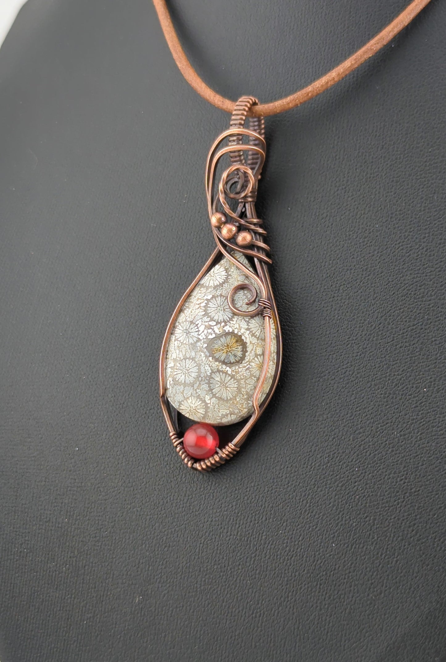 Coral Fossil Pendant, set in antiqued copper, accented with Carnelian.