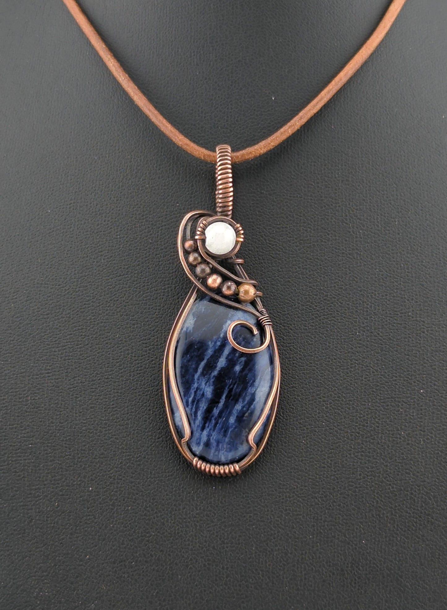 Sodalite Pendant, set in antiqued copper, accented with Moonstone.