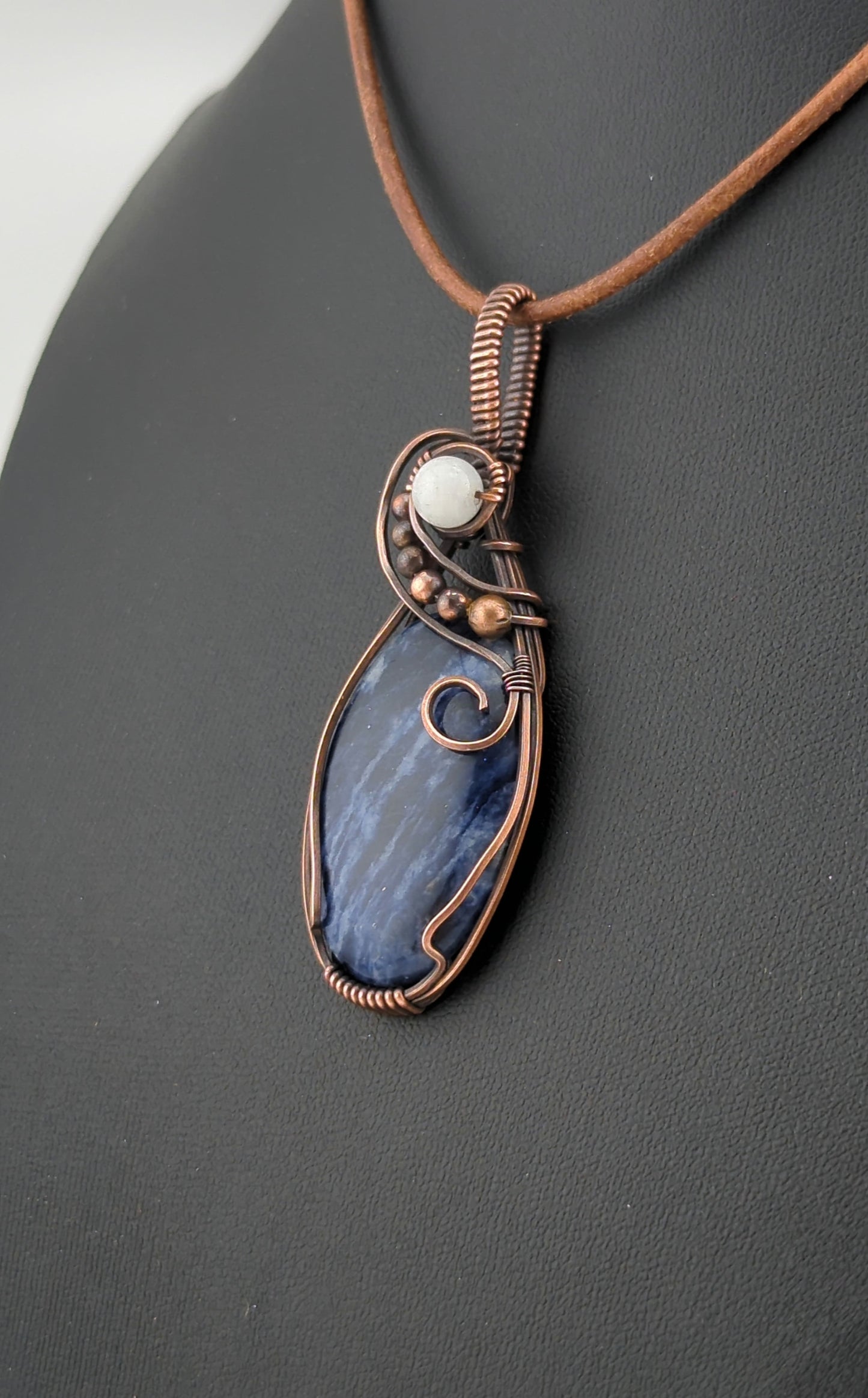 Sodalite Pendant, set in antiqued copper, accented with Moonstone.