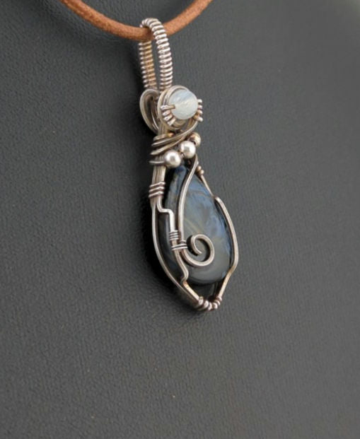 Pietersite Pendant, set in Sterling Silver, accented with Moonstone.