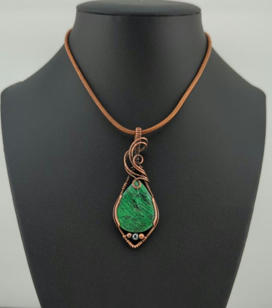 Maw Sit Sit Pendant, set in antiqued copper, accented with Hematite.