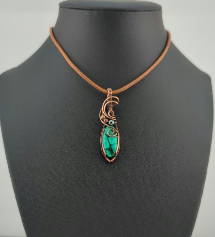 Malachite Gemstone Pendant, set in antiqued copper, accented with Hematite.