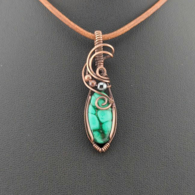 Malachite Gemstone Pendant, set in antiqued copper, accented with Hematite.