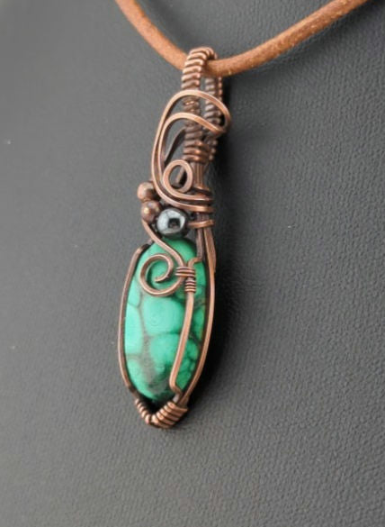 Malachite Gemstone Pendant, set in antiqued copper, accented with Hematite.