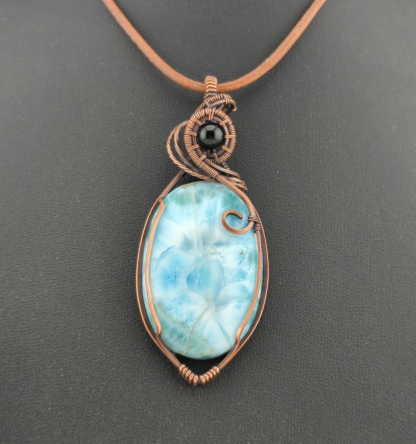 Larimar gemstone pendant, accented with black onyx, set in antiqued copper.