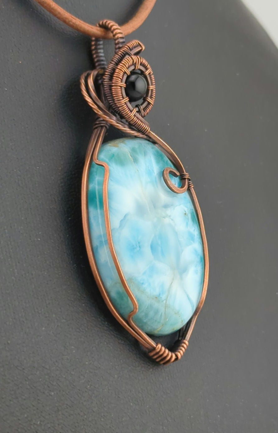 Larimar gemstone pendant, accented with black onyx, set in antiqued copper.