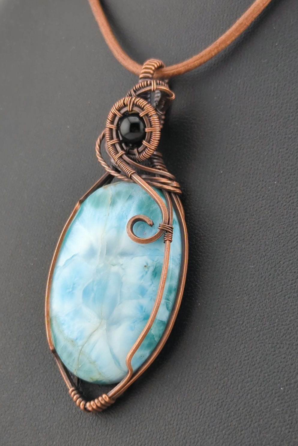 Larimar gemstone pendant, accented with black onyx, set in antiqued copper.