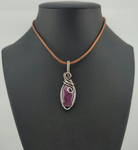 Ruby gemstone pendant, set in antiqued sterling silver.