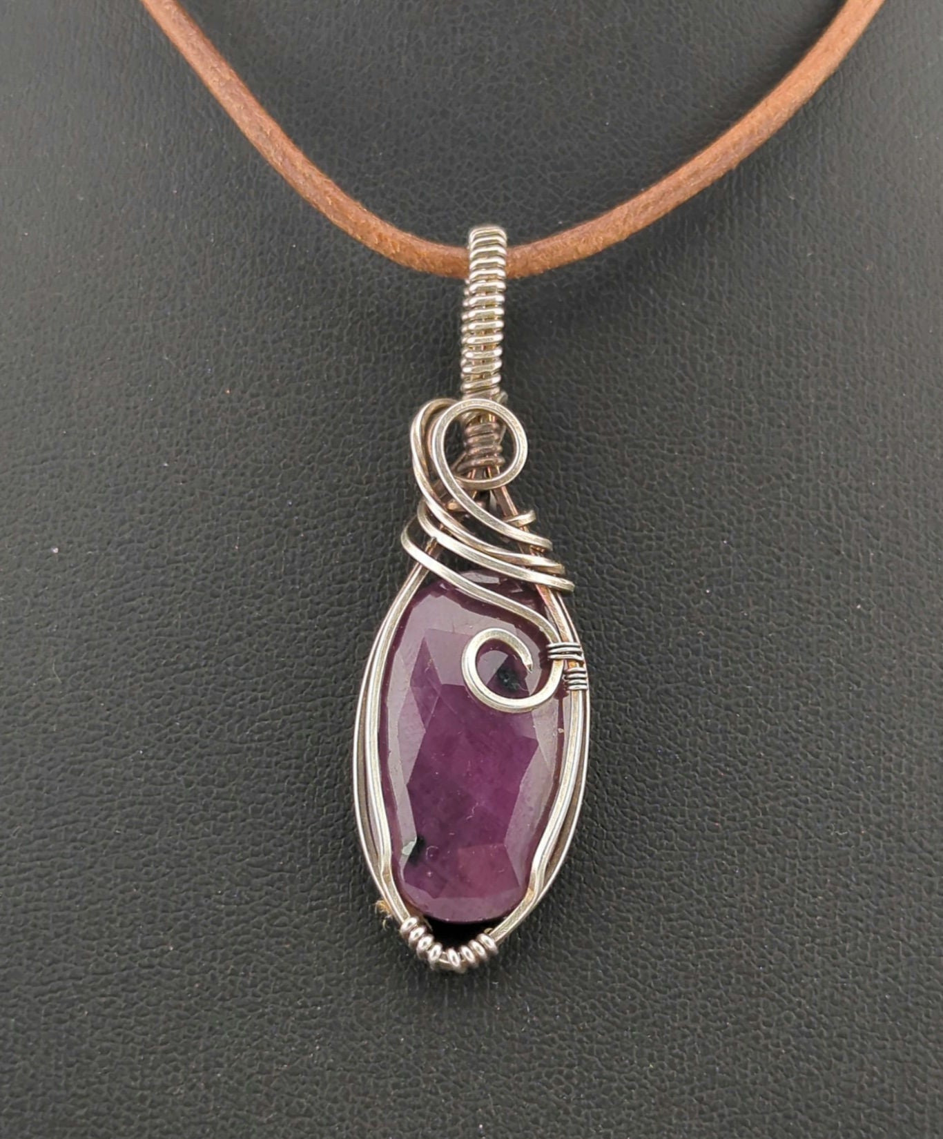 Ruby gemstone pendant, set in antiqued sterling silver.