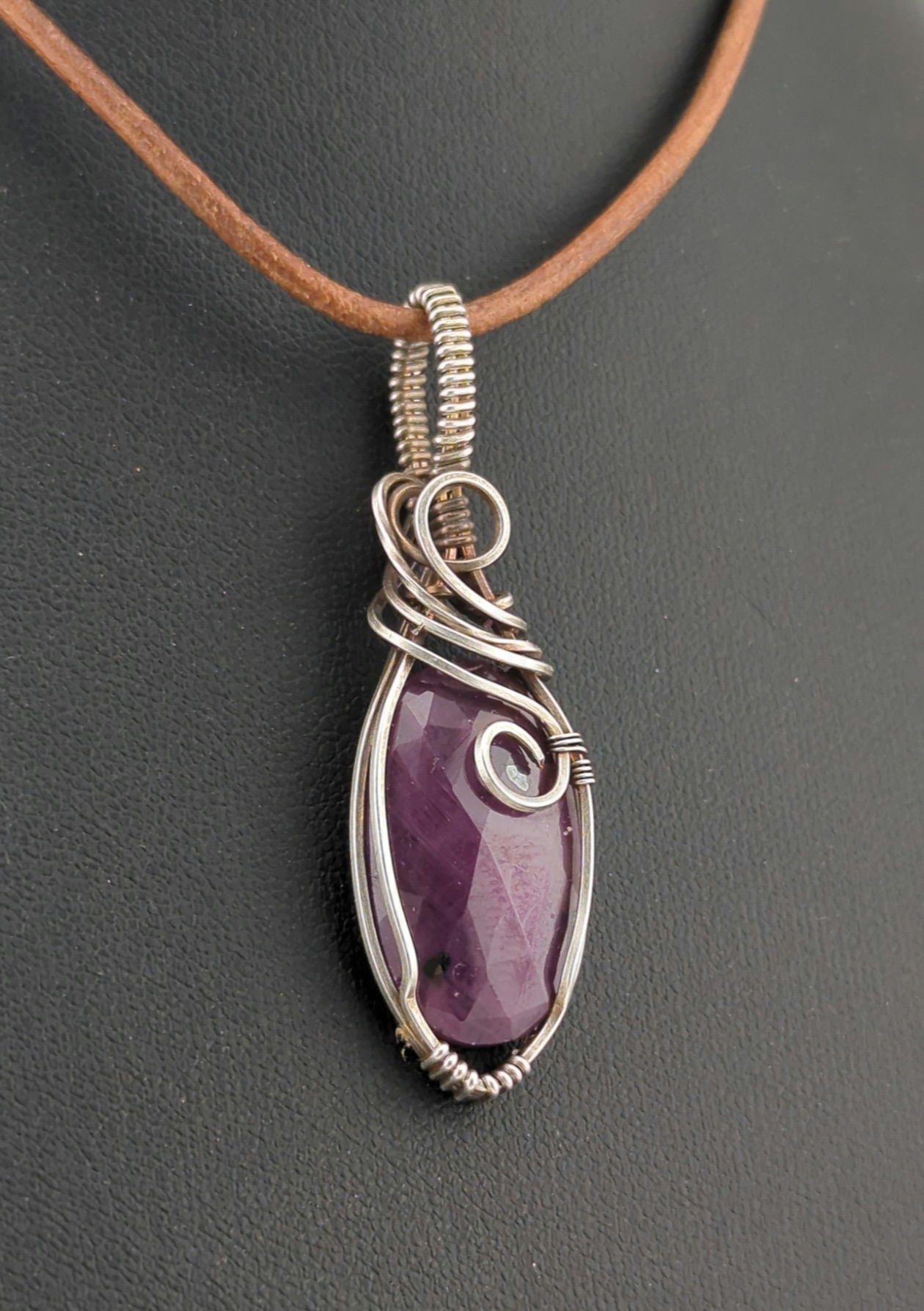 Ruby gemstone pendant, set in antiqued sterling silver.