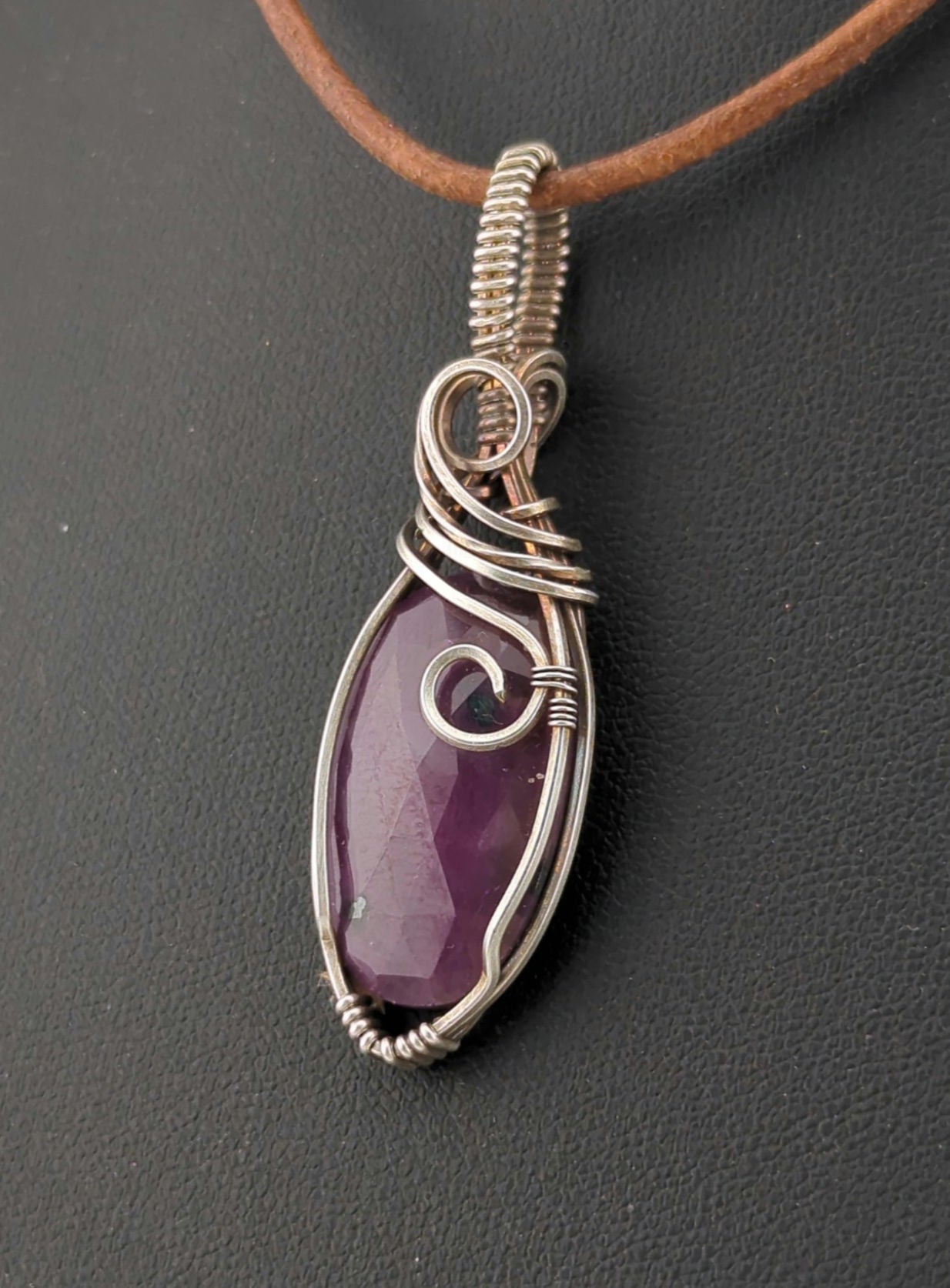 Ruby gemstone pendant, set in antiqued sterling silver.