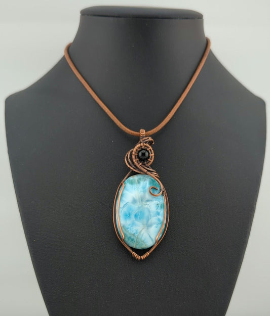 Larimar gemstone pendant, accented with black onyx, set in antiqued copper.