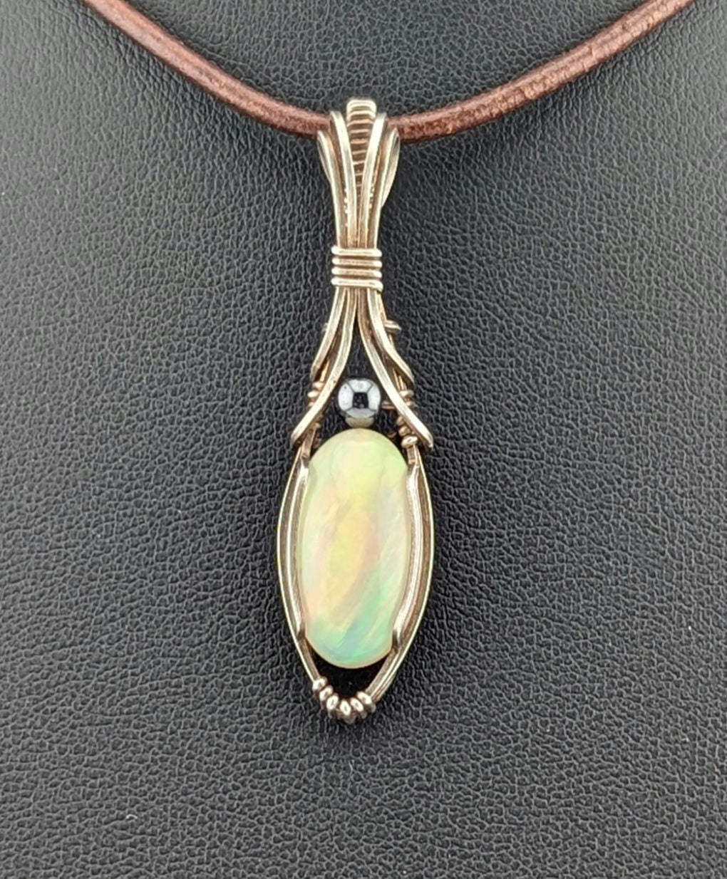 Ethiopian Opal Gemstone Pendant, accented with Hematite and set in Sterling Silver