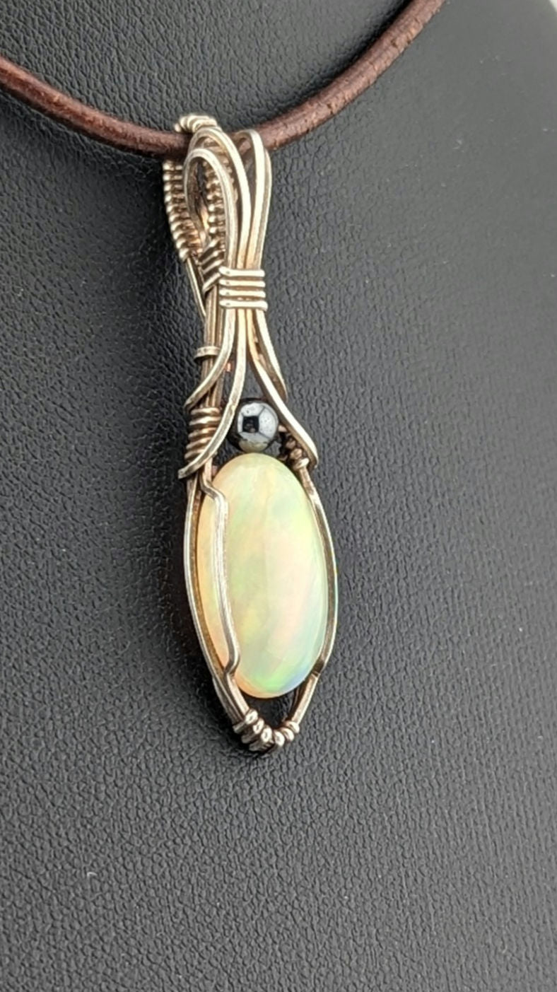 Ethiopian Opal Gemstone Pendant, accented with Hematite and set in Sterling Silver