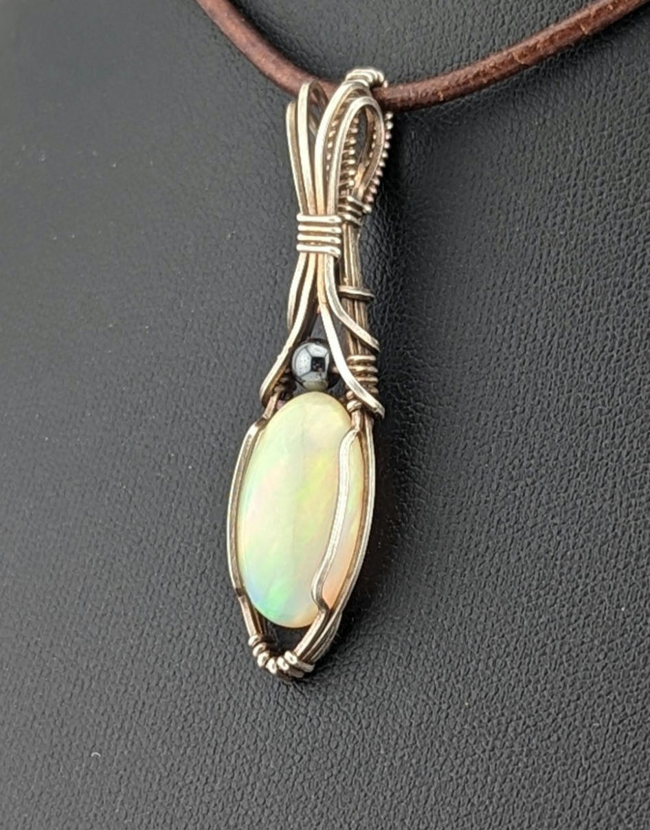 Ethiopian Opal Gemstone Pendant, accented with Hematite and set in Sterling Silver