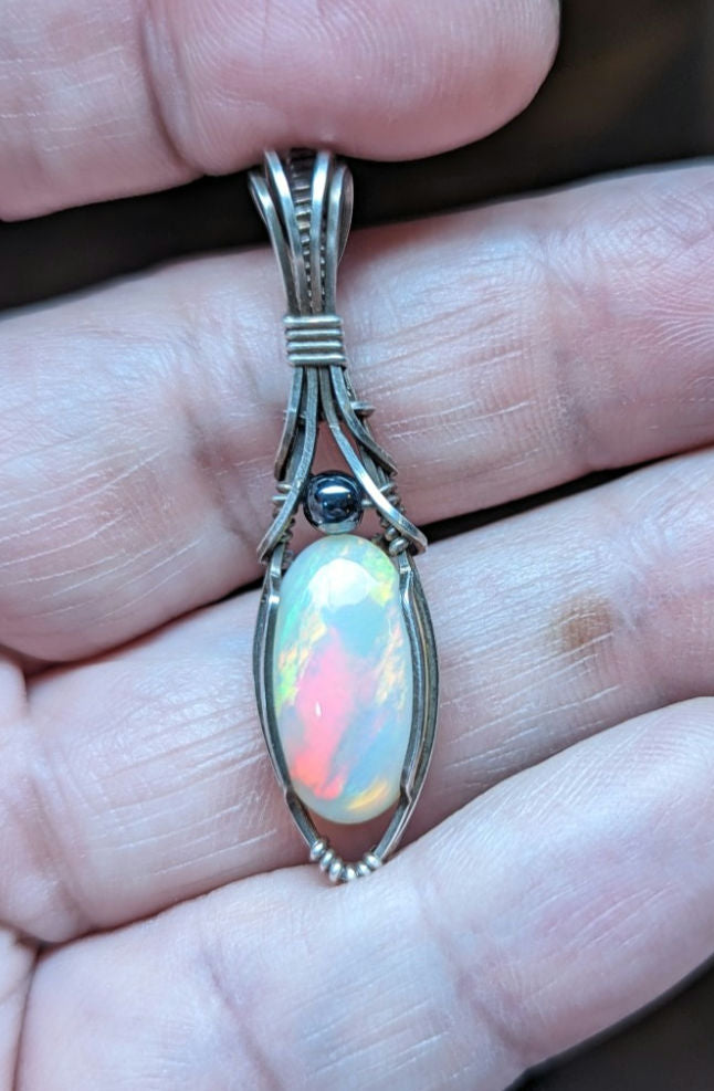 Ethiopian Opal Gemstone Pendant, accented with Hematite and set in Sterling Silver