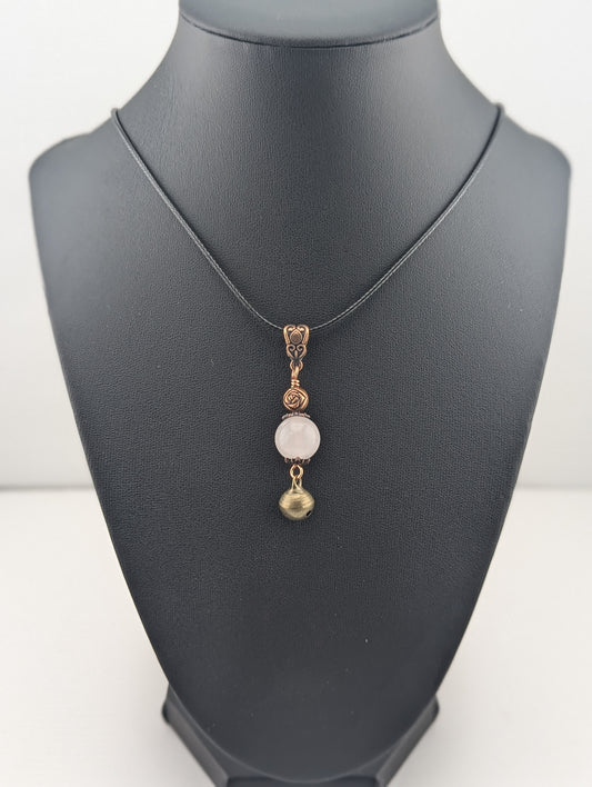 Rose Quartz pendant with Jingle Bell, in antiqued copper finish