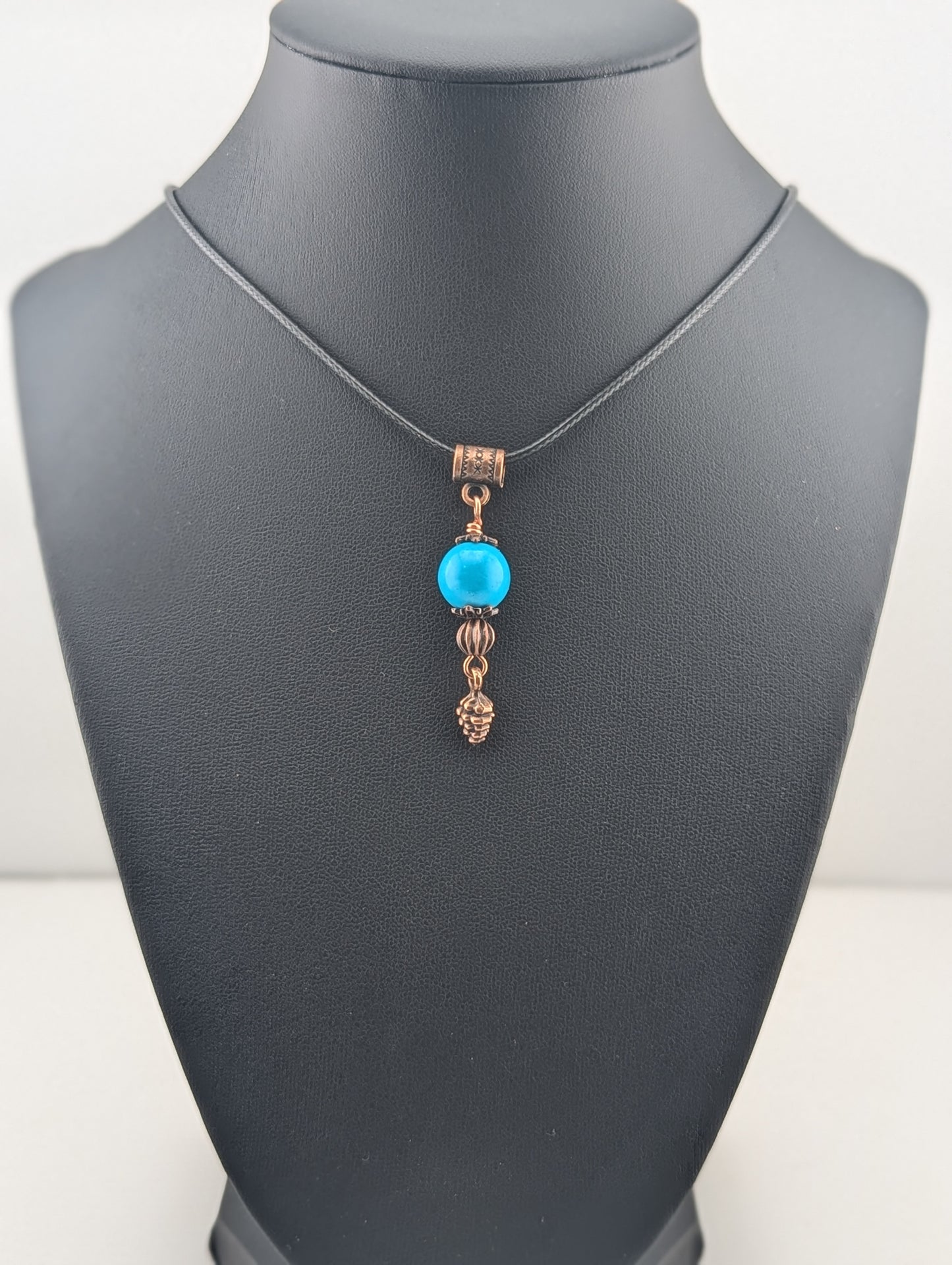 Turquoise pendant with Pine Cone, in antiqued copper finish