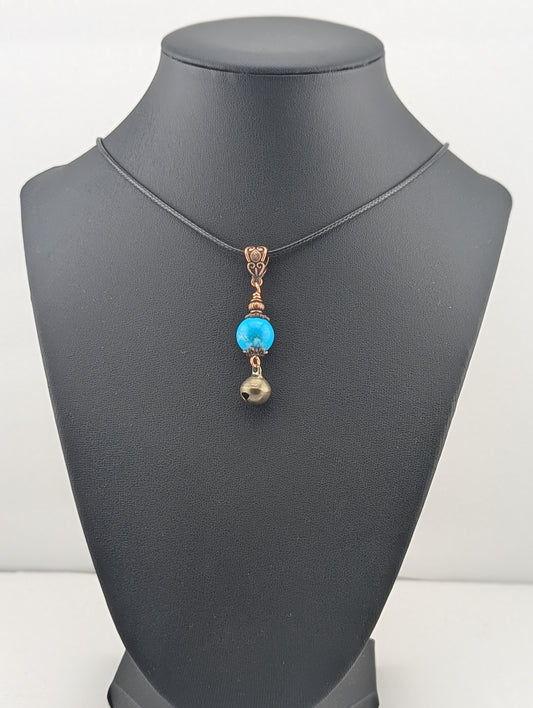 Turquoise pendant with a Jingle Bell, in antiqued copper finish