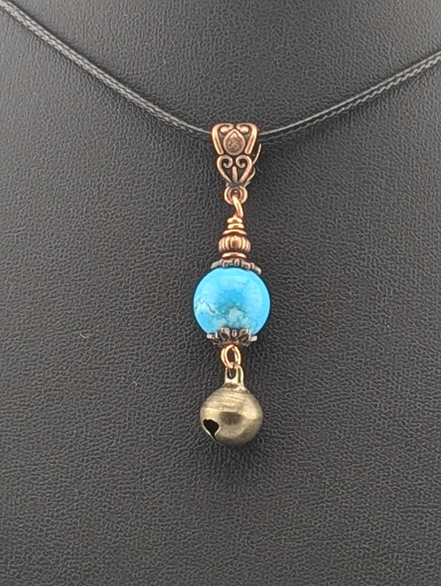 Turquoise pendant with a Jingle Bell, in antiqued copper finish