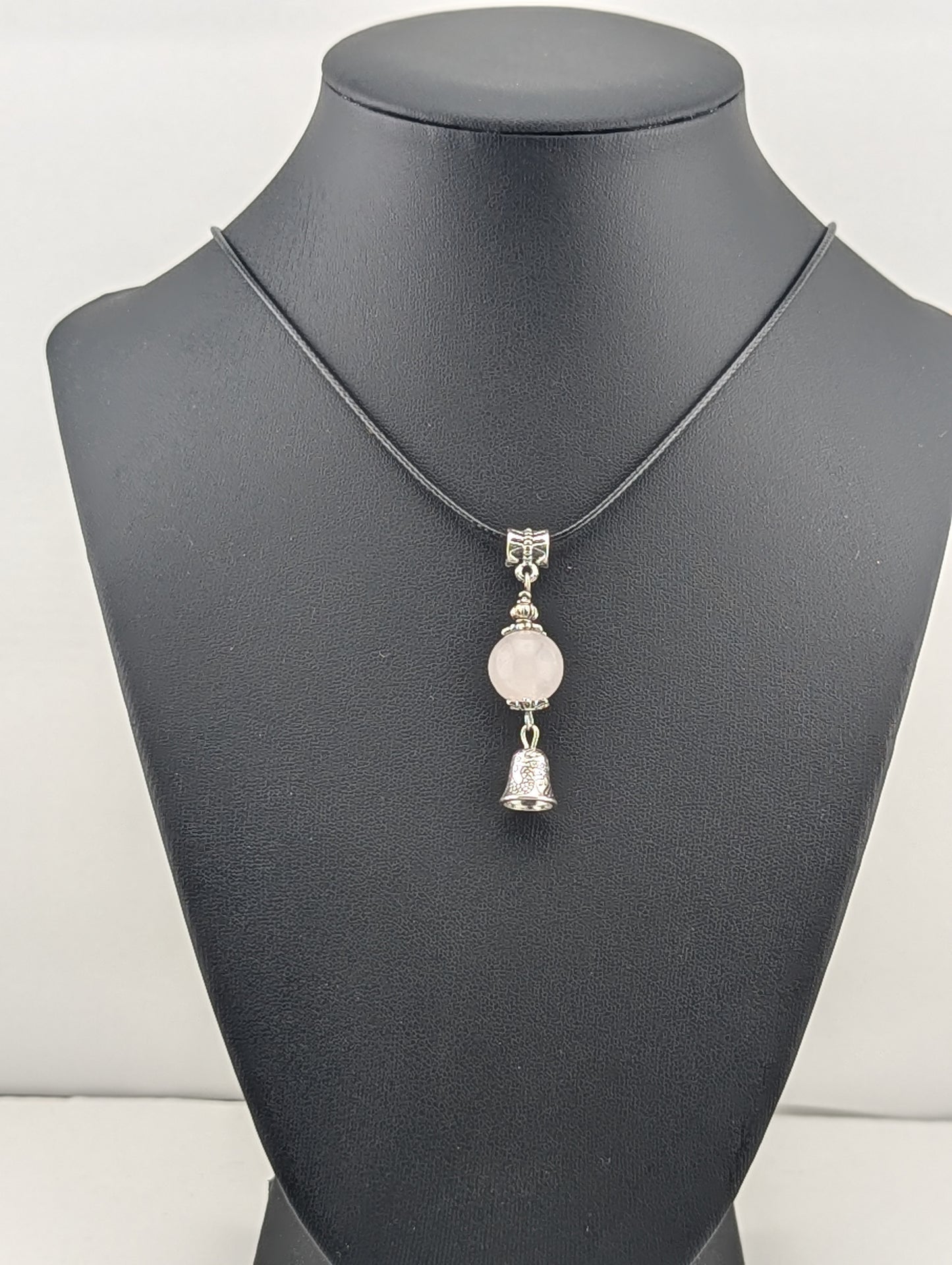 Rose Quartz pendant with Bell, in antiqued Silver finish