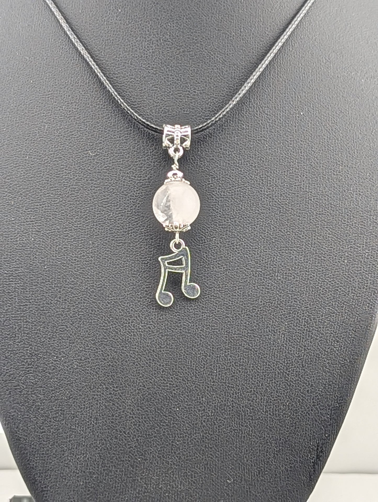 Rose Quartz pendant with a music note charm in antiqued Silver finish