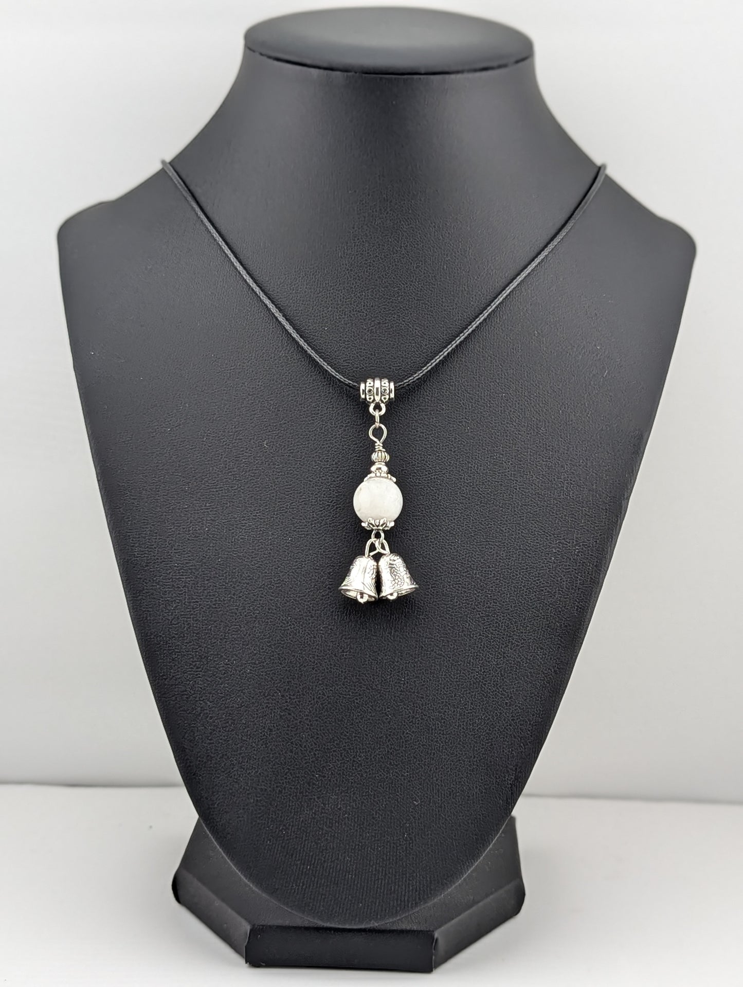 Moonstone pendant with a Silver Bell charm in antiqued Silver finish