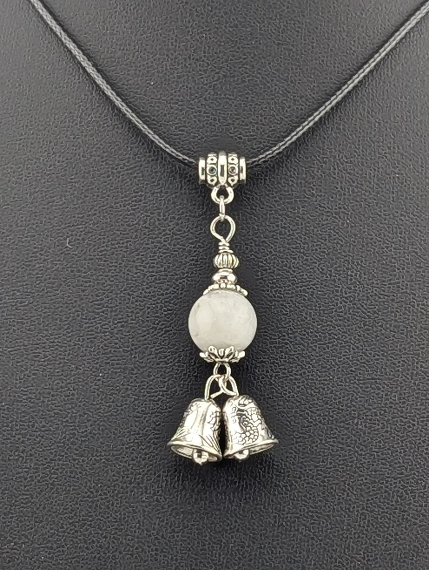 Moonstone pendant with a Silver Bell charm in antiqued Silver finish