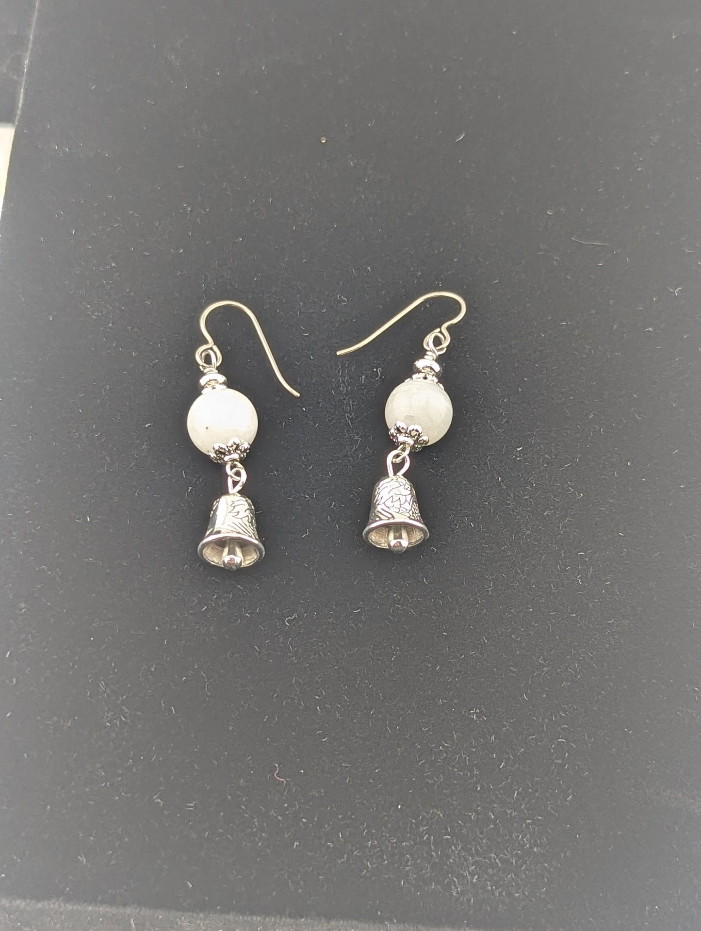 Moonstone earrings with a Bell charm in antiqued Silver finish