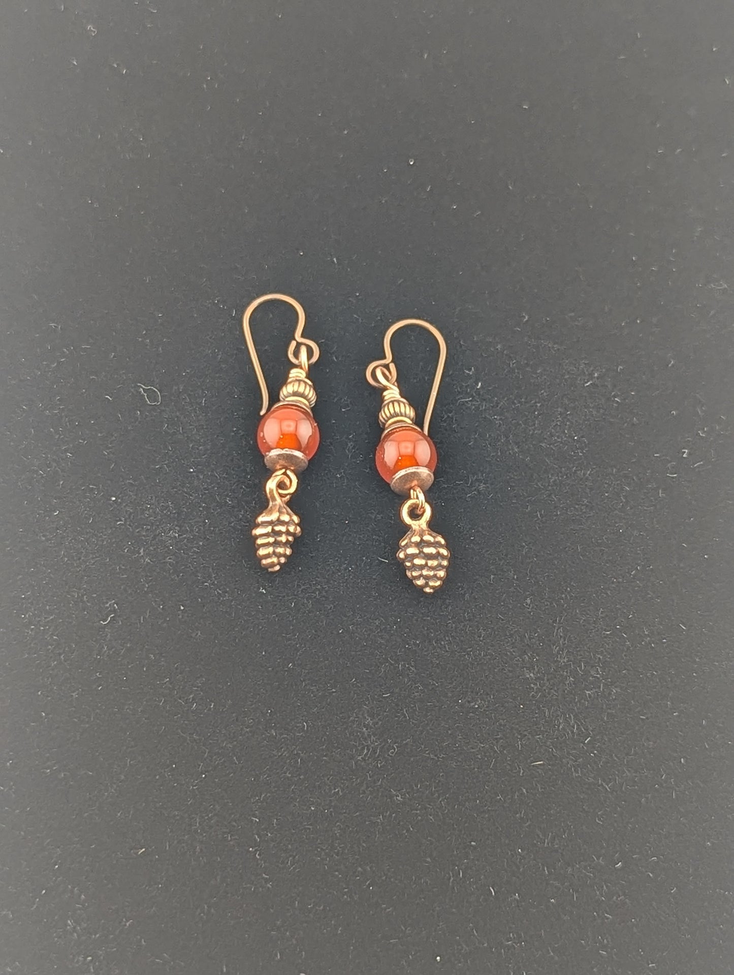 Carnelian earrings with a Pine Cone charm in antiqued Copper finish