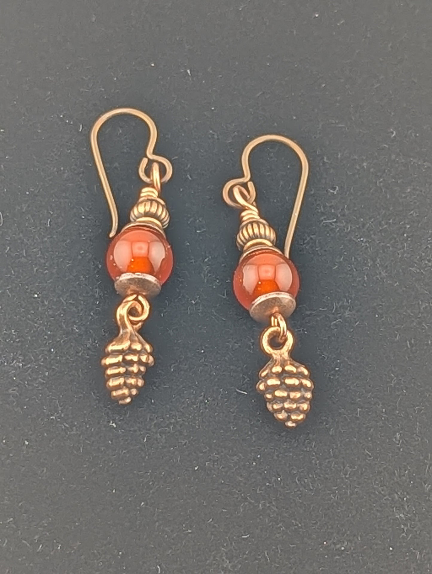 Carnelian earrings with a Pine Cone charm in antiqued Copper finish